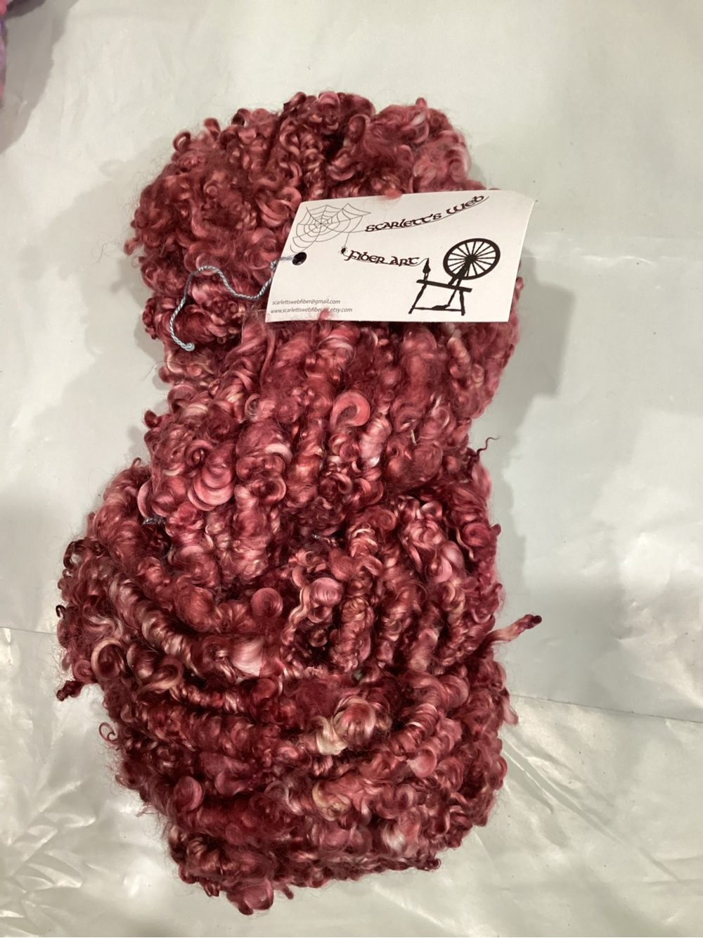 Scarlett’s web fiber arts core spun art yarn Hank